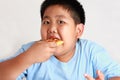 The Fat Boy Too much weight Eat pizza with a lot of dough. Royalty Free Stock Photo