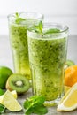 Fat burning green fruit cocktail with kiwi, lemon, mint and parsley