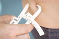 Fat caliper measuring bodyfat Royalty Free Stock Photo