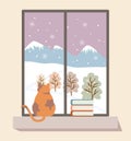 Fat cat with a pile of books on the right side enjoying the outdoor view of the winter landscape from behind the window. Royalty Free Stock Photo