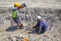 Fat construction workers wearing yellow safety vest and helmet