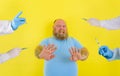 Fat doubter man has doubts about covid-19 vaccine Royalty Free Stock Photo