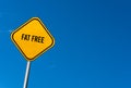 fat free - yellow sign with blue sky Royalty Free Stock Photo