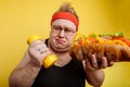 Fat man choise between sport and fastfood Royalty Free Stock Photo