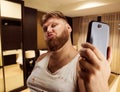 Fat glamour man takes selfie