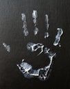 Fat human hand imprint on black background