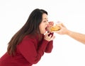 Fat hungry woman eating a hamburger and donut Royalty Free Stock Photo