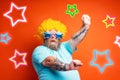 Fat man with beard, tattoos and sunglasses dances music on a disco Royalty Free Stock Photo