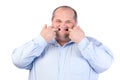 Fat Man in a Blue Shirt, Contorts Antics Royalty Free Stock Photo