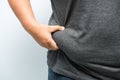 Fat man checking out his weight isolated on white background Royalty Free Stock Photo