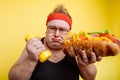 Fat man choise between sport and fastfood Royalty Free Stock Photo