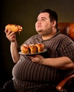 Fat man eating fast food hot dog. Breakfast for overweight person. Royalty Free Stock Photo