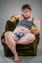 Fat man eating hamburger Royalty Free Stock Photo