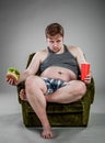 Fat man eating hamburger Royalty Free Stock Photo