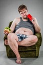 Fat man eating hamburger Royalty Free Stock Photo