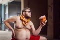 Fat man looks at big wurst Royalty Free Stock Photo