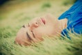 Fat Man Lying on the Green Grass to Relax Royalty Free Stock Photo