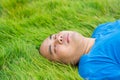 Fat Man Lying on the Green Grass to Relax Royalty Free Stock Photo