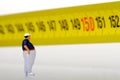 Fat man on a measurer - miniature Royalty Free Stock Photo