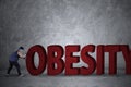 Fat man pushing an obesity word