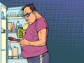 Fat man at the refrigerator. Night hunger. Overweight and health, diet