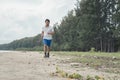 Fat man running on the beach Royalty Free Stock Photo