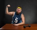 Fat man shows his muscle Royalty Free Stock Photo