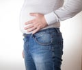 A fat man in a small, tight white shirt. Uncomfortable clothing concept, obesity. Slimming Royalty Free Stock Photo