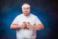 Fat man with two dumbbells in each hand Royalty Free Stock Photo