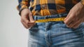 a fat man is using Waist measuring tape to measure his waist, overweight concept