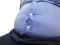 Fat man wear tight blue shirt on white background. Fat man get paunchy. Royalty Free Stock Photo