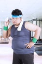 Fat man wiping sweat after exercise Royalty Free Stock Photo