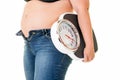 Fat overweight woman carrying a bathroom scale Royalty Free Stock Photo