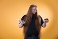 A fat red-haired man holds water and a cake. Royalty Free Stock Photo