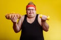 Fat man choise between sport and fastfood Royalty Free Stock Photo