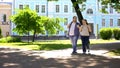 Fat student couple walking in city park, urban date, leisure time, friendship Royalty Free Stock Photo