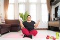 Fat woman asian exercising relaxation vitality on lotus position at home Royalty Free Stock Photo