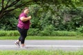 Fat woman asian running at the park,