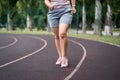 Fat woman with cellulite legs on a morning jog, healthy lifestyle concept Royalty Free Stock Photo