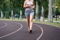 Fat woman with cellulite legs on a morning jog, healthy lifestyle concept