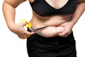 Fat Woman Cut obesity belly cellulite by scissors weight loss plastic surgery concept Royalty Free Stock Photo