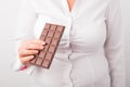 Fat woman eating chocolate Royalty Free Stock Photo