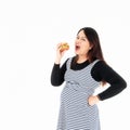 Fat woman eating hamburger in hand