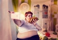 Fat woman eats sandwich and makes selfie, obesity Royalty Free Stock Photo