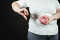 Fat woman fighting the temptation to eat junk food Royalty Free Stock Photo