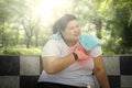 Fat woman having heart attack in the park