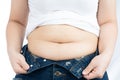 Fat woman holding excessive fat belly, overweight fatty belly isolated on over white background. Diet lifestyle, weight loss, Royalty Free Stock Photo