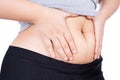 Fat woman holding excessive fat belly, overweight fatty belly isolated on over white background. Diet lifestyle, weight loss, Royalty Free Stock Photo