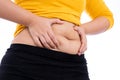 Fat woman holding excessive fat belly, overweight fatty belly isolated white background. Diet lifestyle, weight loss, stomach Royalty Free Stock Photo