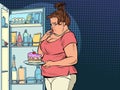 Fat woman at the open refrigerator with food, obesity and excess weight Royalty Free Stock Photo